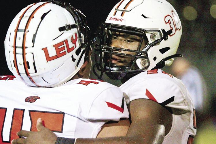 1. Seniors Jaime Cisneros and Guerschom Guerrier embrace between plays at the end of playoff games against Dunbar..tif