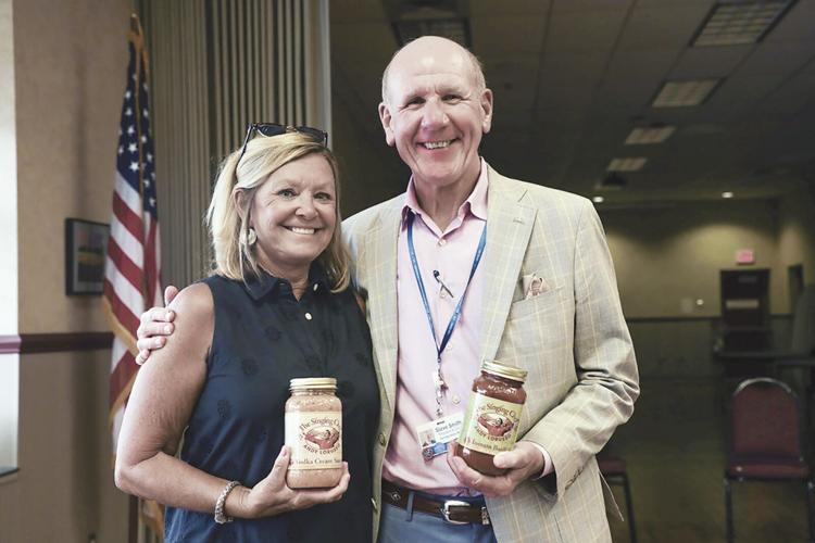 2. Debbie and Steve Smith, owners of Food City, with Sing Chef Andy LoRusso’s sauces..tif