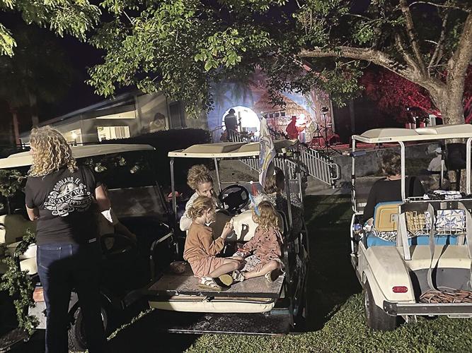 2. Many concert goers arrived by golf cart.tif