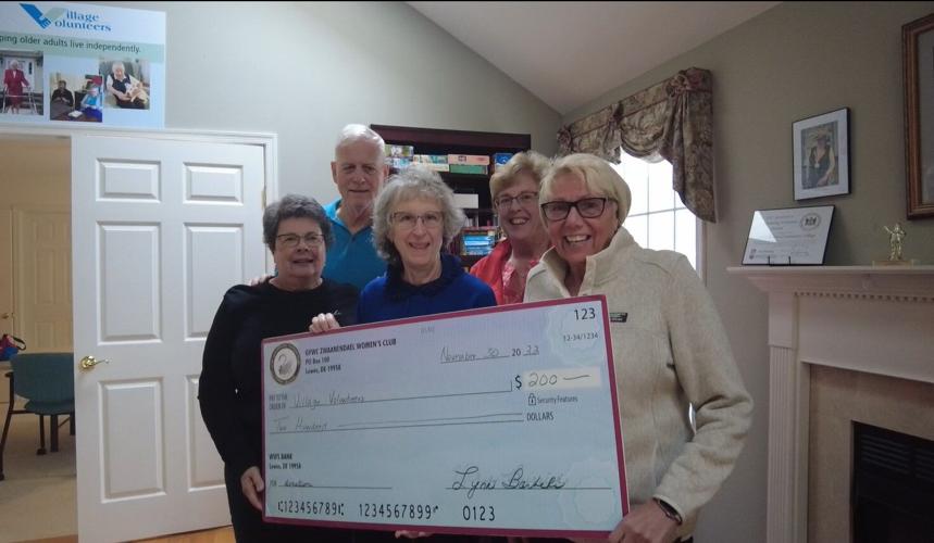 Volunteers from the Village Volunteers with a recent donation from the Zwaanendael Women's Club.