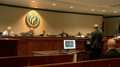 Worcester County Commissioners being presented to, inside of their meeting chambers.