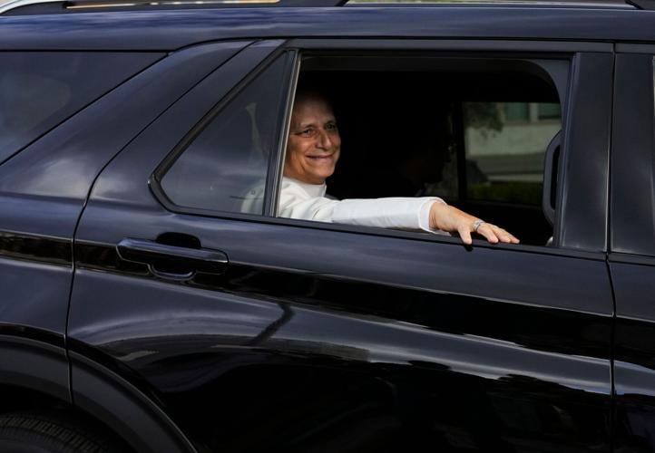 Pope Leo heads back to the Vatican as well-wishers cheer, in photos