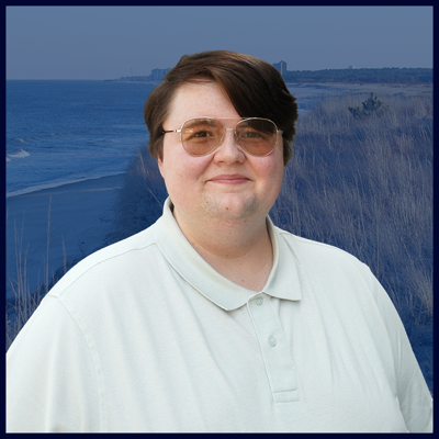 A headshot of Steven with a blue beach background.