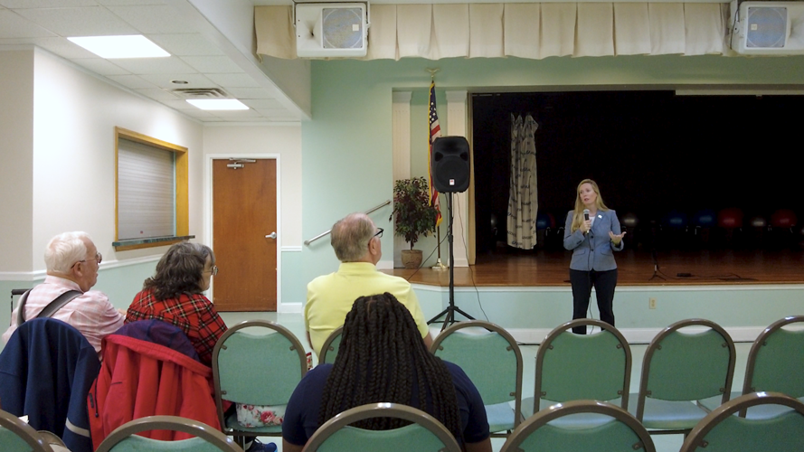 Davis speaking at meeting