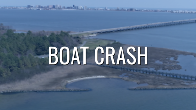 An aerial shot of the Isle of Wight Bay, tinted blue, with the words "Boat Crash" over it.