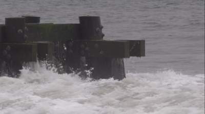 Waves crashing in Rehoboth Beach due to tropical activity offshore.