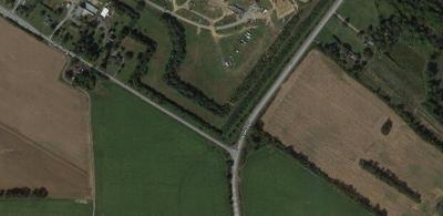 Woman's body found along road in New Castle