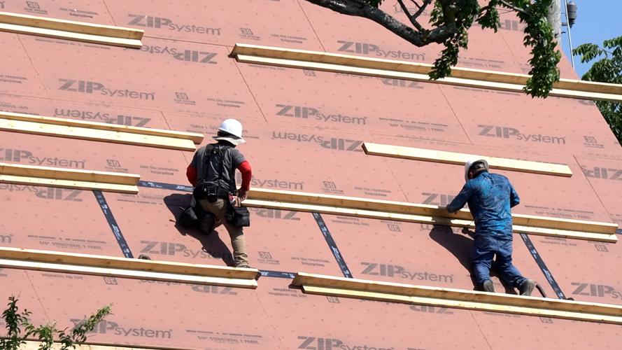 Roofers working