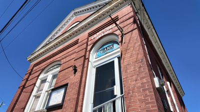 The over 100-year-old building, once serving as a bank and town hall, that is now up for sale. 