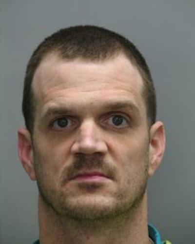 Man breaks into car, hits owner in the head