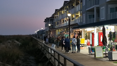 the Bethany Beach boardwalk in the evening.