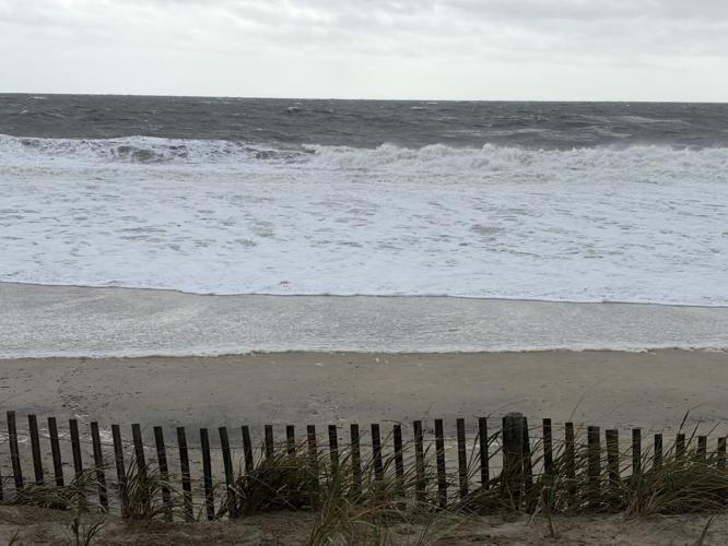 Waves on Rehoboth Beach creep closer to the dune.
