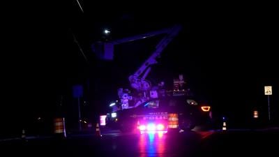 Crews working on pole