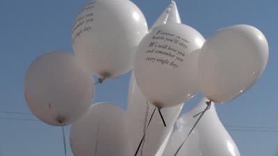 Families held balloons at Velasquez's funeral