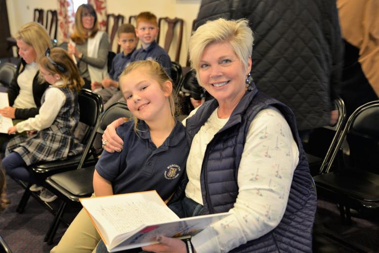 Landon Moreland from Pocomoke City paused from reading her story to smile with her grandmother, Beth Sharpley. Courtesy Worcester Preparatory School.