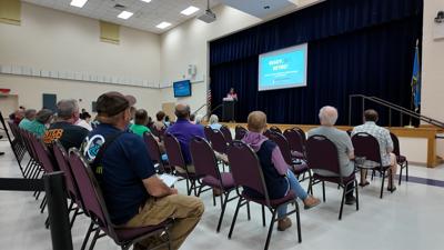 People listening to the information session. 