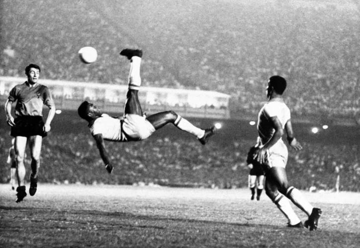 FILE - Brazil's soccer star Pele bicycle kicks a ball during a game at unknown location, Sept. 1968. (AP Photo File)