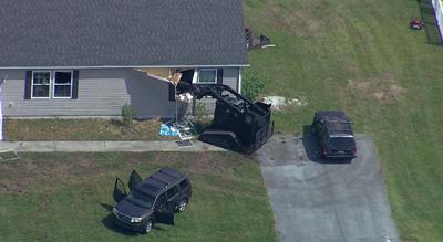 Police breach barricaded home