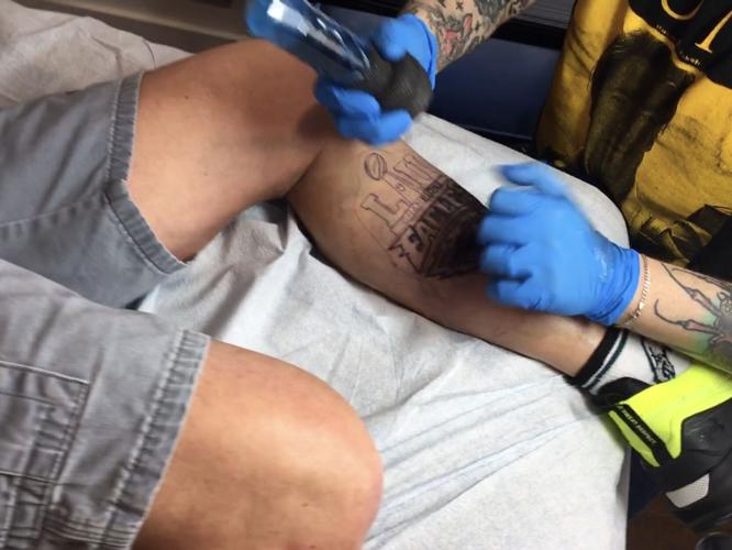 John Hilt, of Lewes, receiving a tattoo on Wednesday in honor of a past Eagles Super Bowl win.