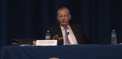 Dr. Joe Arminio sitting at the forum where the controversy stemmed from.