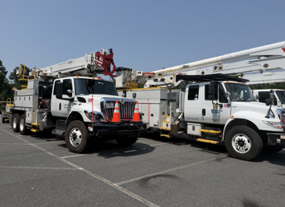 Delmarva Power trucks similar to what crews will utilize in assisting with restoring power in Illinois