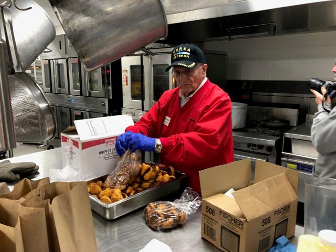 A volunteer helped prepare meals to deliver to homebound seniors. Courtesy CHEER Community Center.