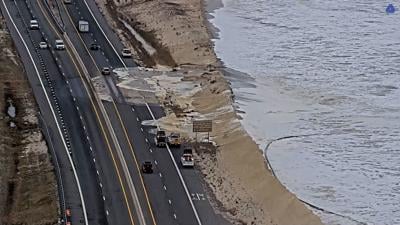 Water breaches dune near Indian River Inlet Bridge