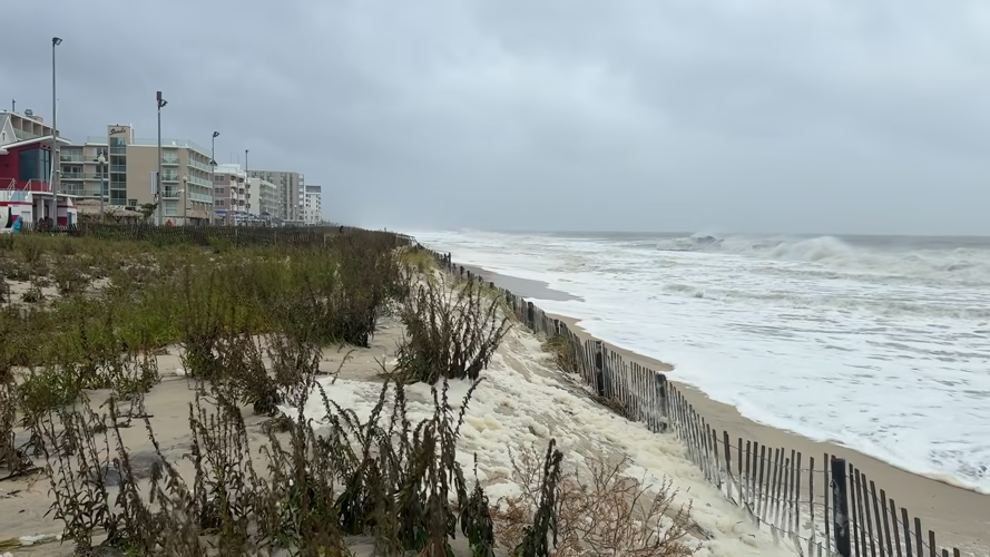 The waves are approaching the dune barrier.