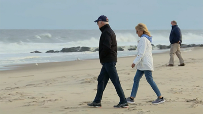 The First Couple walks on the beach