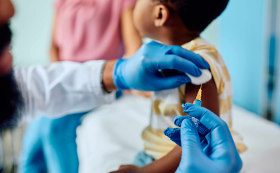 Child getting a vaccine at the doctor