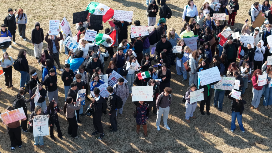 More students hold signs during a peaceful walkout at Sussex Central High School in Georgetown on Wednesday.
