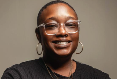 poet, Sharnell “Sista Big” Tull, smiles at the camera 