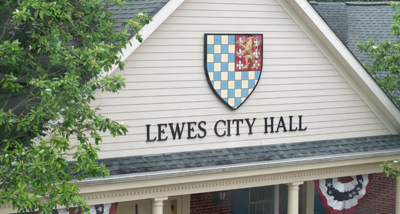 The front of a building showing the city's crest and the words Lewes City Hall.