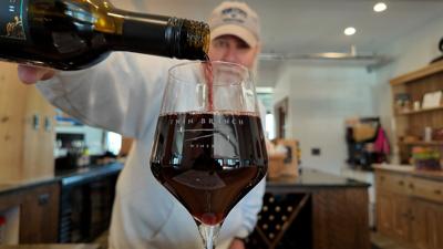 Pouring a glass of wine at Twin Branch Winery in Milton