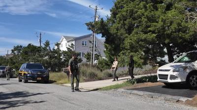 First responders outside of a home on Broadkill Beach.