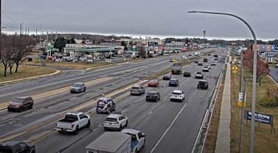 Cars and trucks traveling on the multi-lane Coastal Highway.