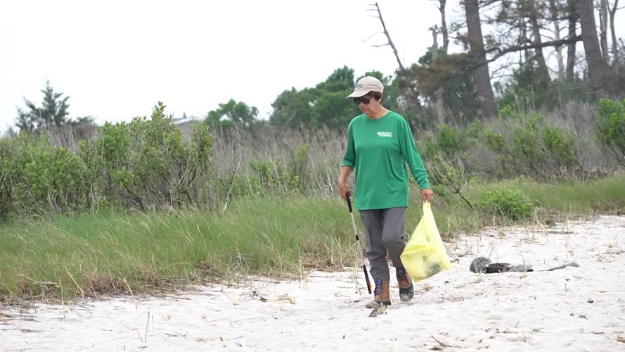 Picking up trash on the beach