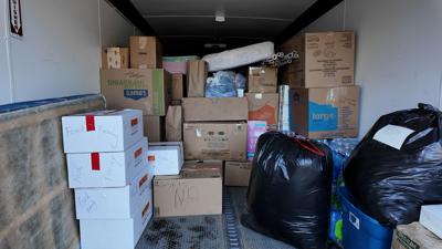 Boxes and bags of donations loaded on to a trailer in Georgetown headed to North Carolina