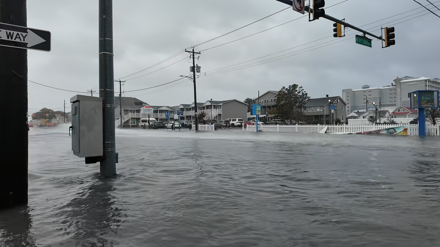 A traffic intersection is flooded with water.