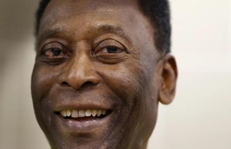 FILE - Brazilian soccer legend Pele smiles during a media opportunity at a restaurant in London, March 20, 2015. (AP Photo/Kirsty Wigglesworth, File)