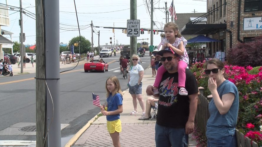 Paradegoers Wave American Flags