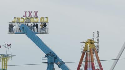 A amusement ride next to the ride "swings"