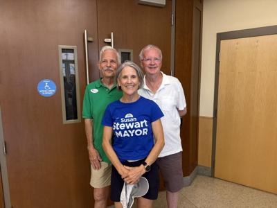 Three winners smile for a photo. Susan Stewart in the front, with Mark Saunders and Patrick Gossett behind her.