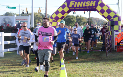 people race to cross the finish line at the ag literacy 5k