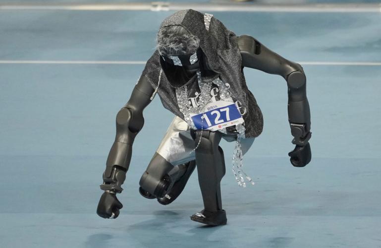 Humanoid robots sprint, play soccer and set records at Beijing games, in photos