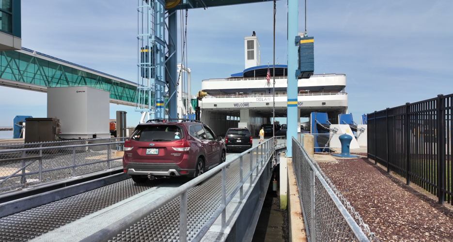 Cars driving onto the ferry.
