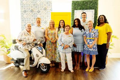 Photo of a group of foundation team members in blue and yellow attire.