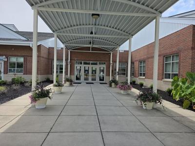 The covered walkway leading to the entrance of the Ocean City Elementary School on Center Dr.