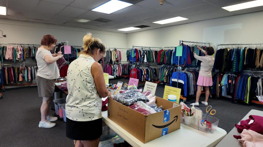 Clothing Our Kids volunteers work to get orders ready for students in need.