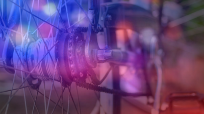 Close up of a bike with red and blue lights.
